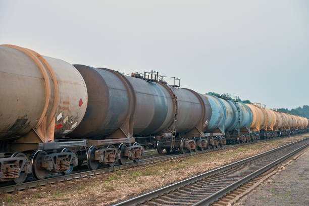 Set of train tanks with oil and fuel transport by rail - countryside view